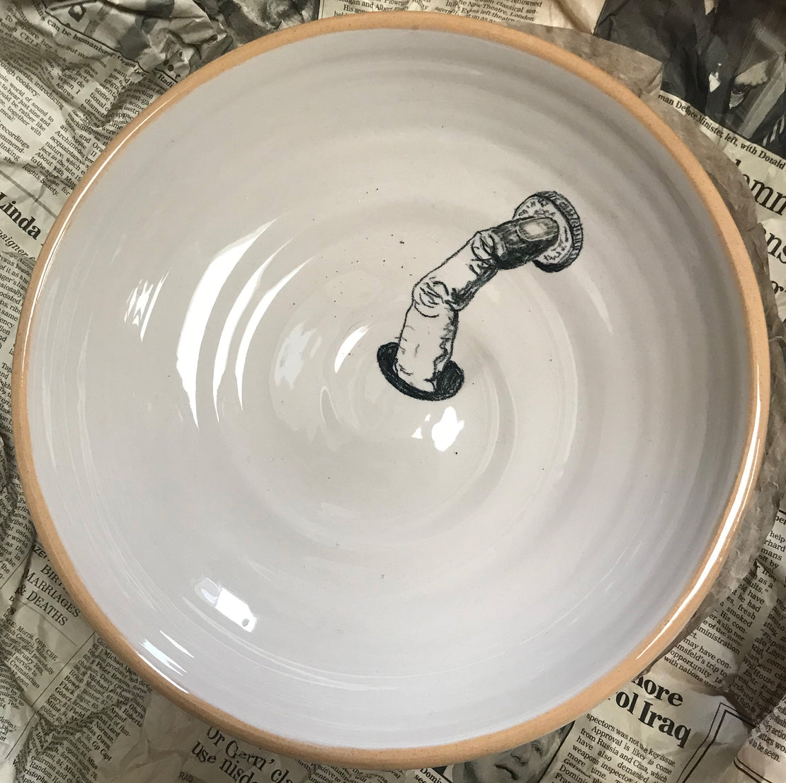 Plate with finger and coin